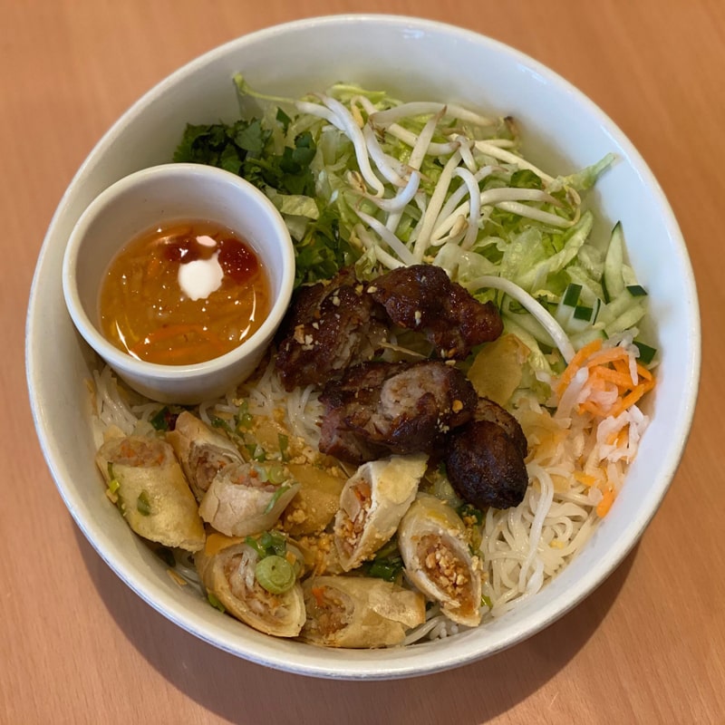 24. Rice Noodles with Egg Rolls and Pork Skewers 24. Rice Noodles with Egg Rolls and Pork Skewers