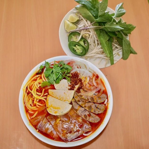 N22. Hot & Spicy Beef Soup Hue Style w Conical Beef, Beef Tendon, Vietnamese Ham over Rice Vermicelli N22. Hot & Spicy Beef Soup Hue Style w Conical Beef, Beef Tendon, Vietnamese Ham over Rice Vermicelli